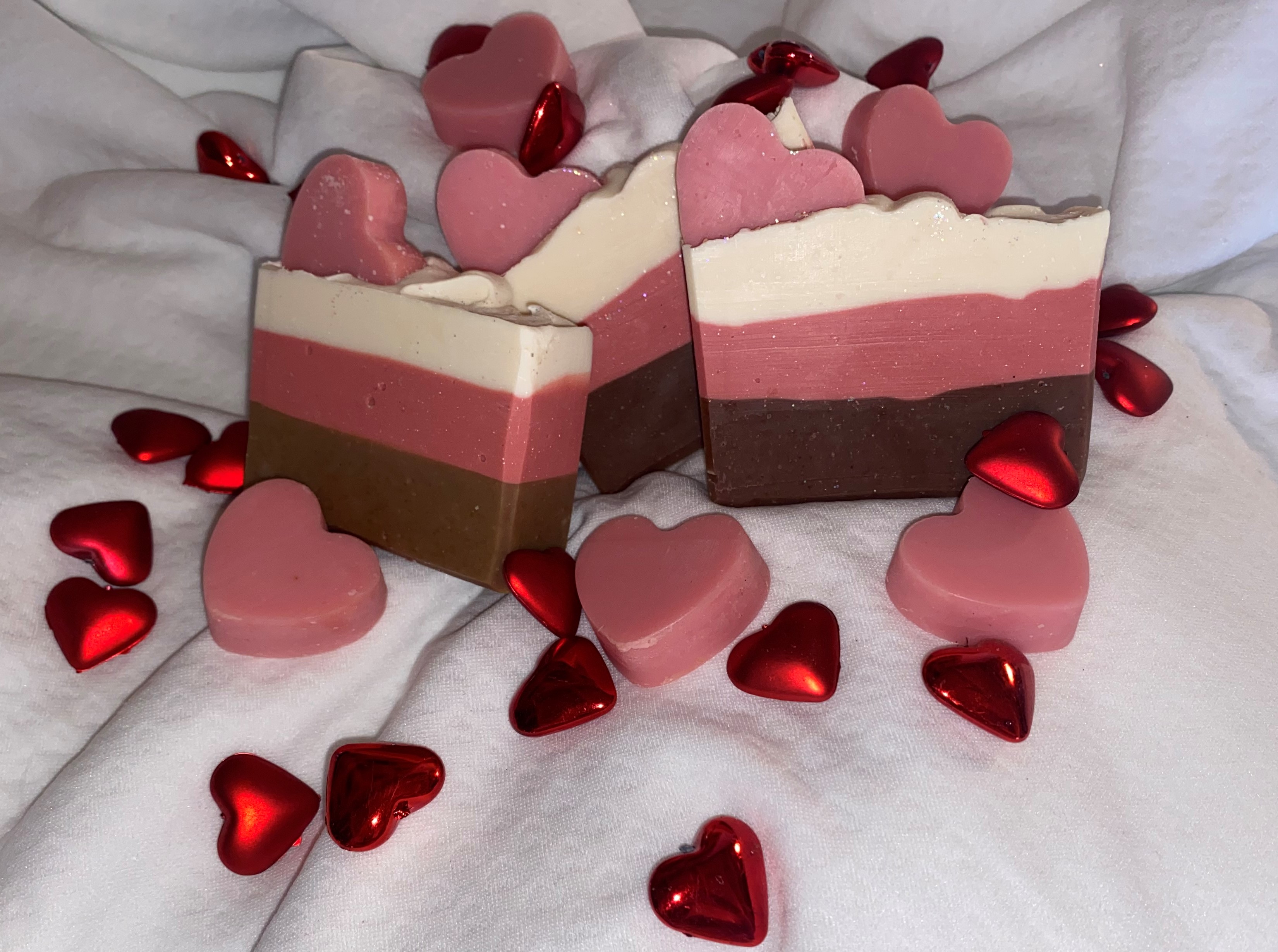 picture of soap with 3 different colors white, pink, and brown