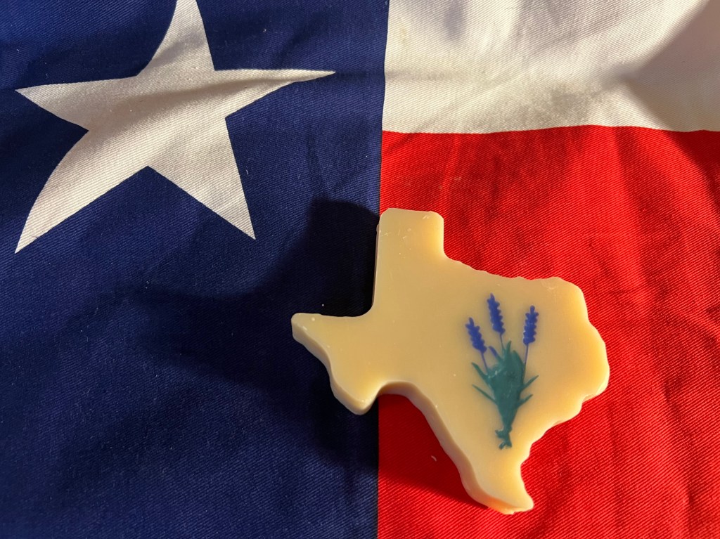 blue bonnets on a Texas shaped soap